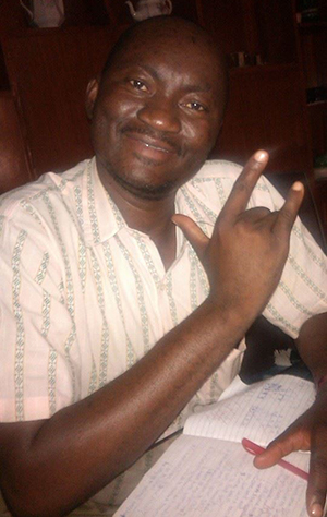 Julius giving the "I love you" hand sign