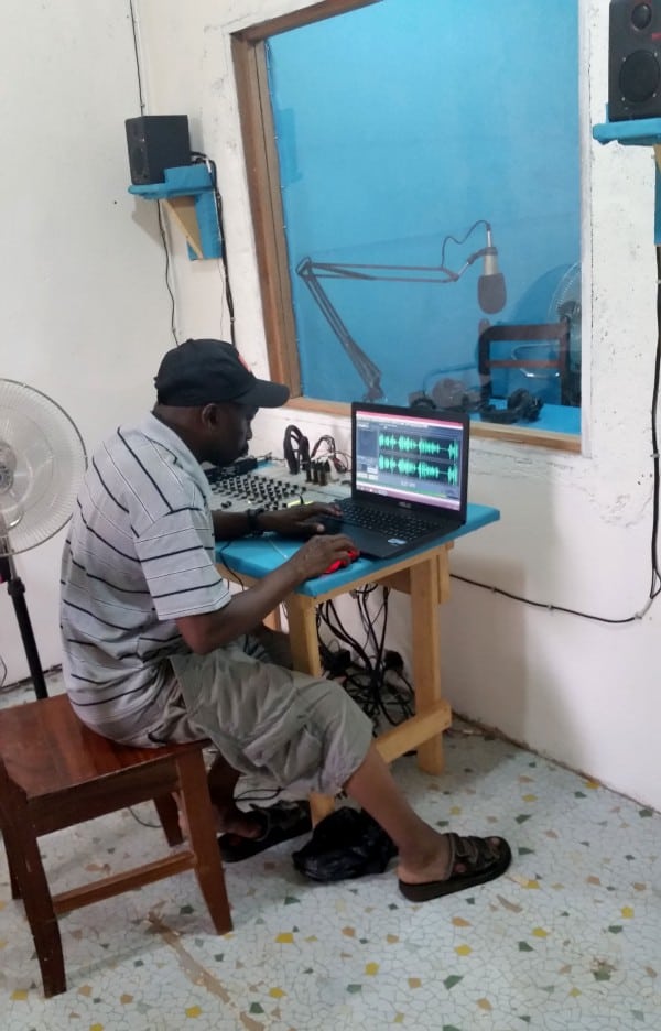 A man works on a laptop computer