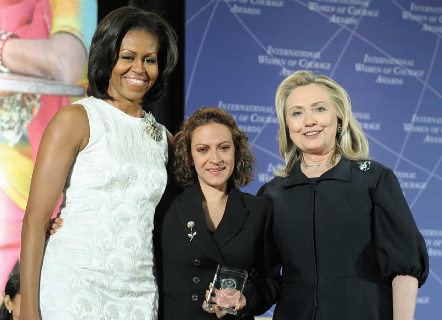First Lady Michelle Obama, left; and Hillary Rodham Clinton, right; and pose for a photo with 2012 International Women of Courage (IWOC) Award Winner Jineth Bedoya Lima of Colombia