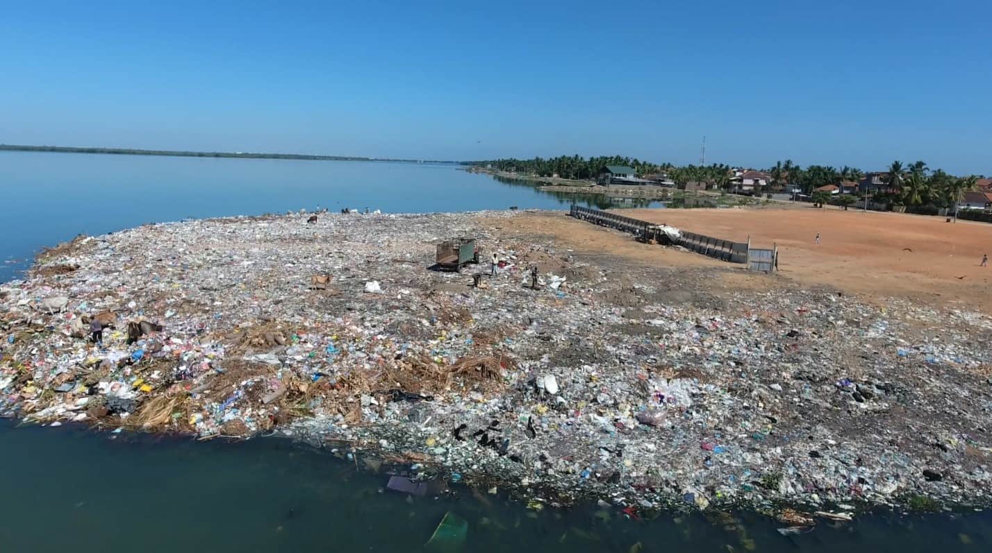 A landfill right on the shore of a lagoon