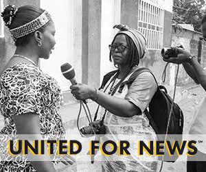 One woman holds a mic up to another woman - United for News
