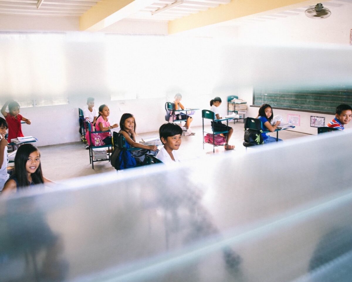 Young people sit in a classroom