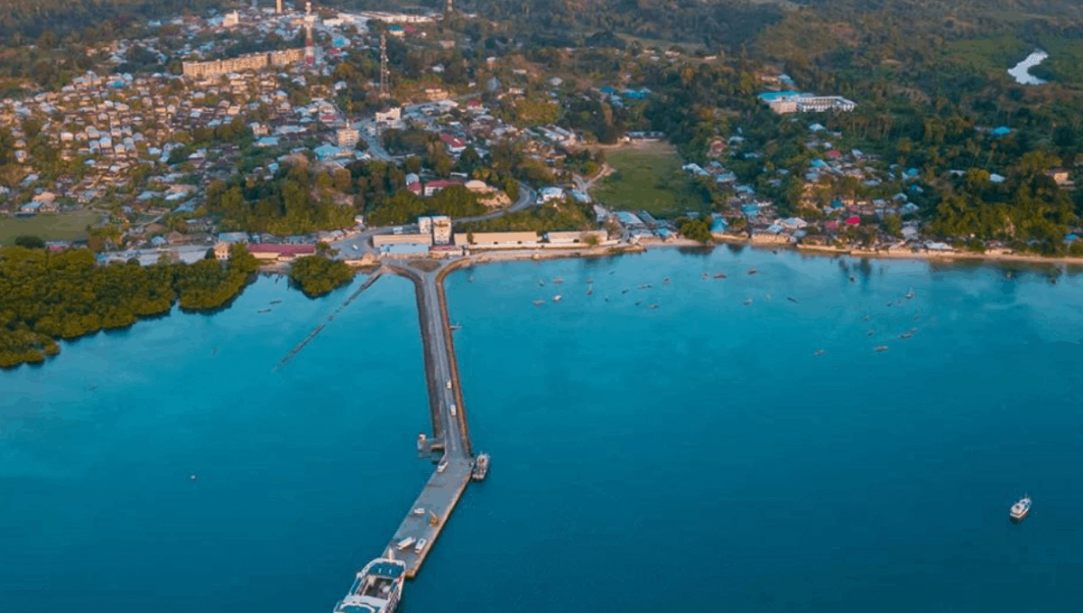 A pier extends out into a body of water