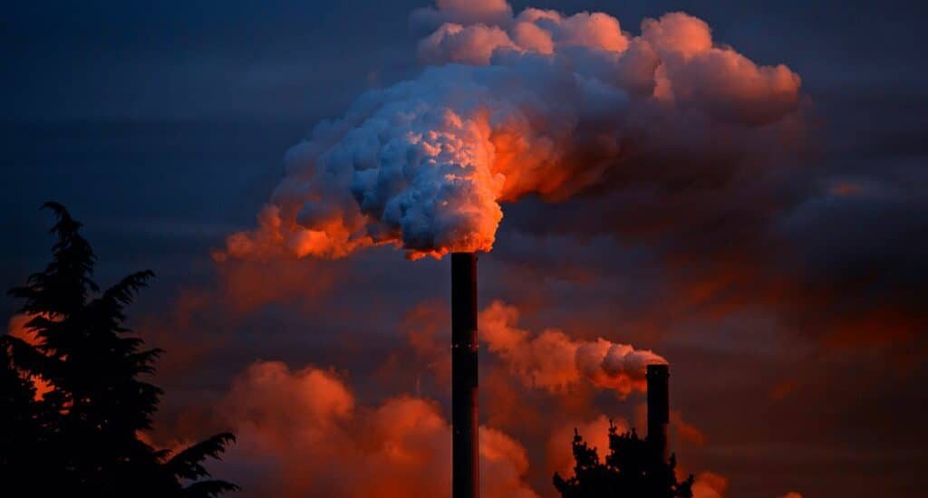 Smoke billows out of chimneys