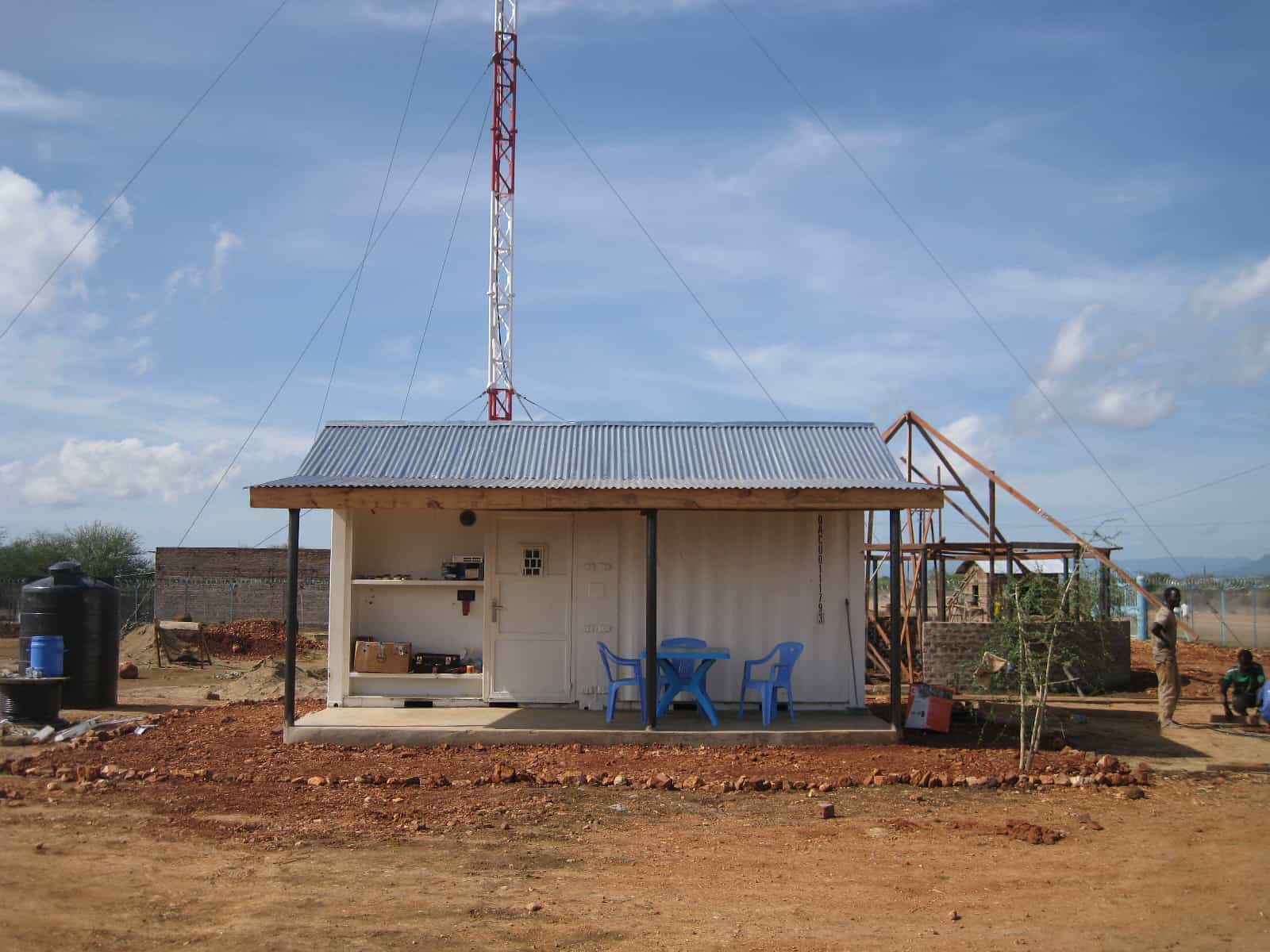Small building with a radio tower.