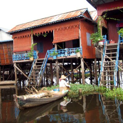 A wood house on stilts in a river
